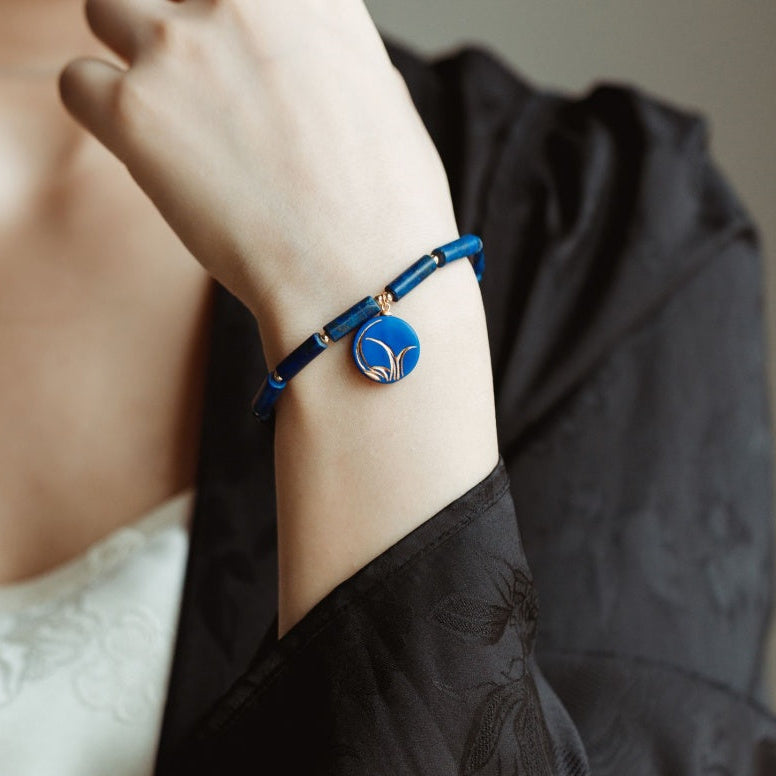 Handcrafted Blue Ceramic Orchid-Themed Jewelry Collection with Golden Floral Patterns